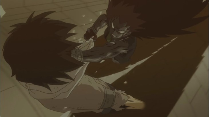 Gajeel punches Rogue